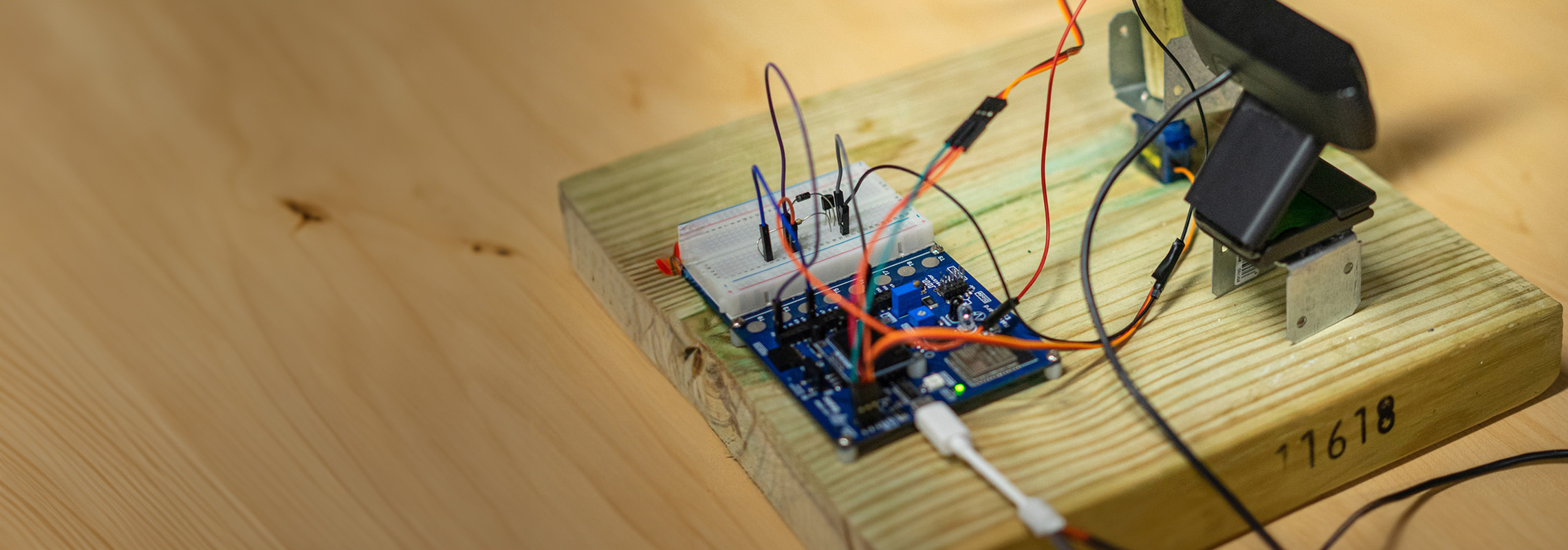 Make project: Microcontroller with wires hooked up to display 