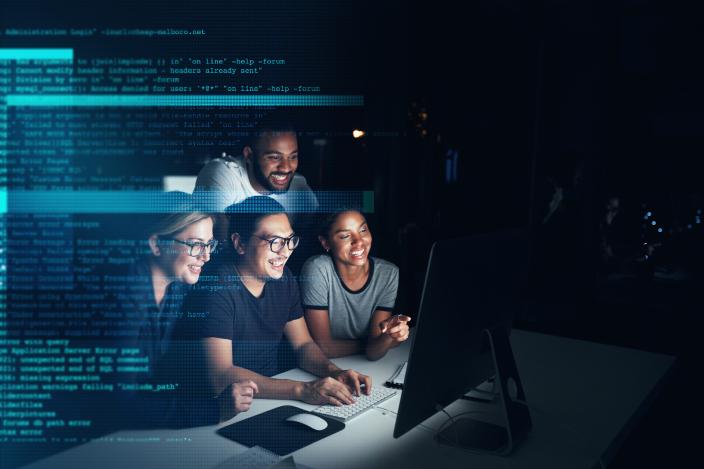A group of students working on a coding project