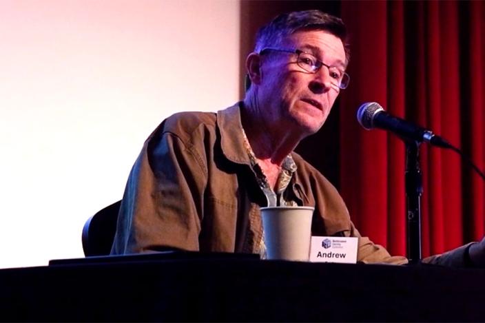 image of Andrew Barto delivering keynote speech during Reinforcement Learning conference