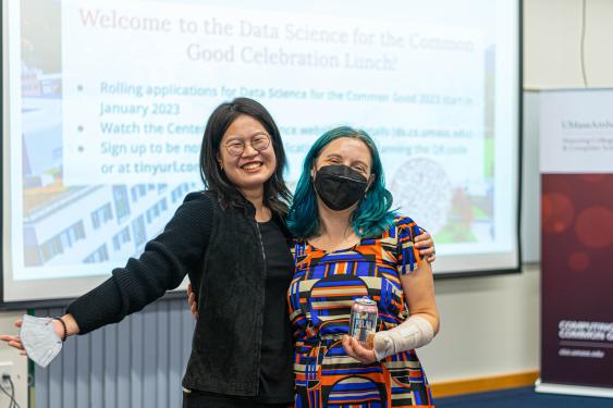 A candid shot of 2 female Master's students