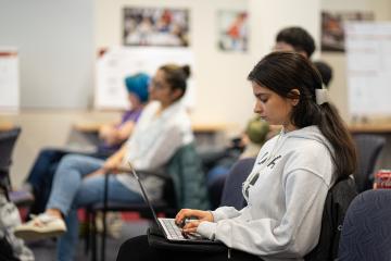 students sitting listening to lecture