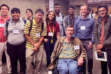 Andy Barto, Scott Neikum pose with current students