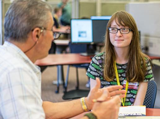 A CICS advisor talking to a student