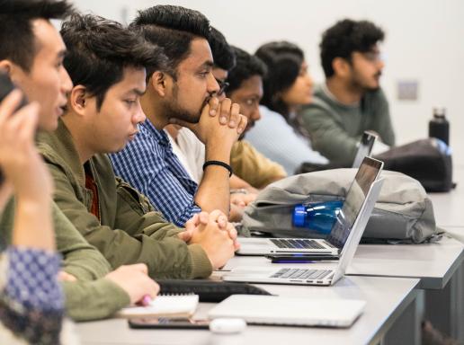 Students in a classroom listening to a lecture