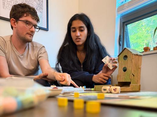 Manning CICS Data Science for the Common Good students converse at a table