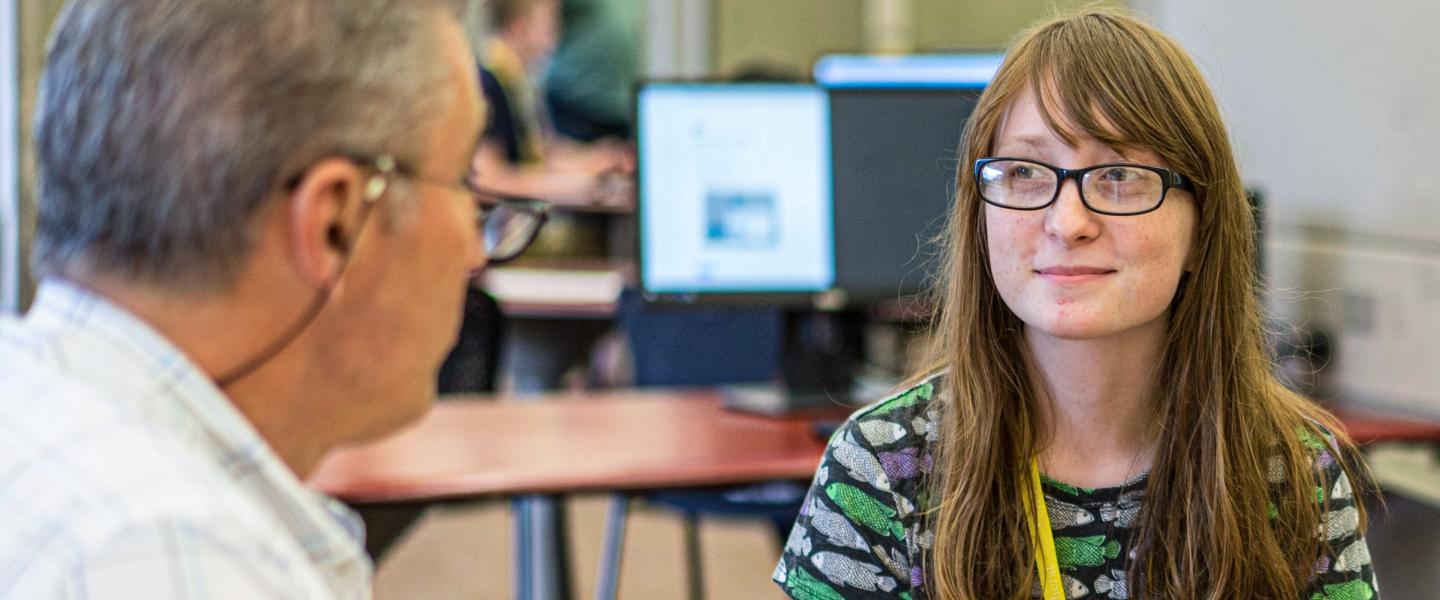 A CICS advisor talking to a student