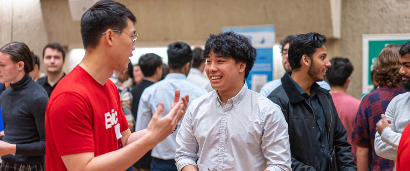 Epic recruiter speaks to a Career Fair attendee in the Campus Center Auditorium during the 2024 Tech Jobs and Internships Fair