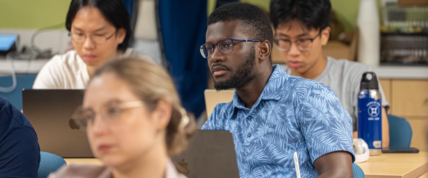 Student in a class listening intently