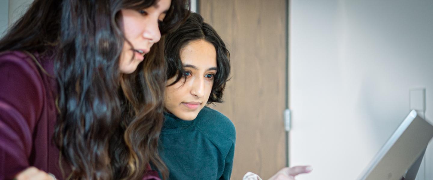Two students working together on a project