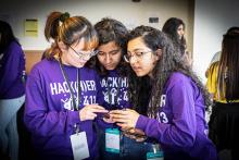 Female students gathered to test their HackHer413 project