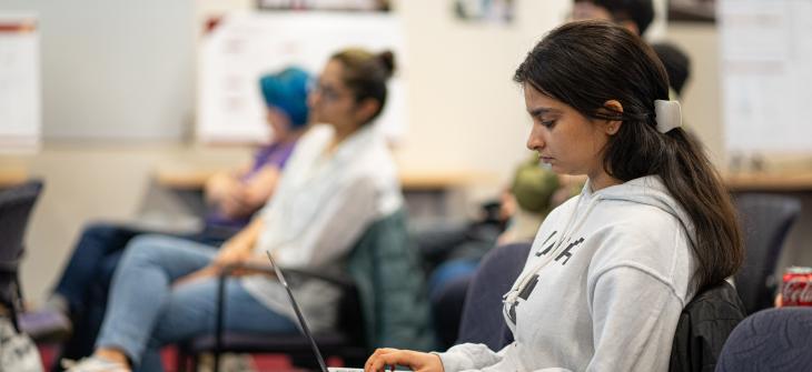 students sitting listening to lecture