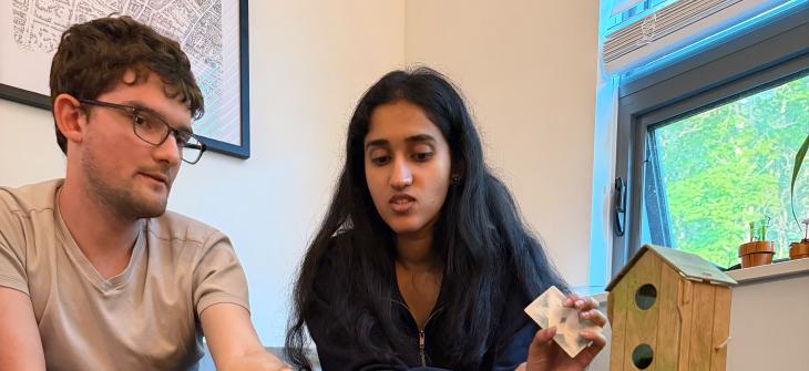 Manning CICS Data Science for the Common Good students converse at a table
