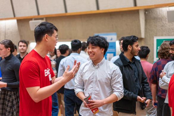 Epic recruiter speaks to a Career Fair attendee in the Campus Center Auditorium during the 2024 Tech Jobs and Internships Fair