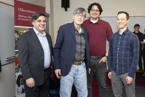 Andrew Barto (second from left) gathered with his former grad students, who are now professors: George Konidaris, associate professor of computer science at Brown University, and Philip Thomas and Scott Niekum, both UMass Amherst associate professors of computer science.