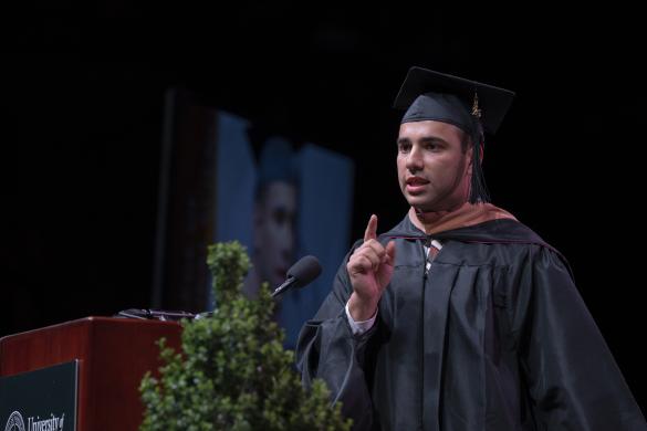 student speaking during umass master's commencement