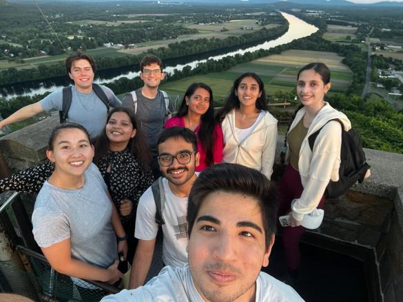 Manning College of Information and Computer Sciences students in the Data Science for the Common Good program pose at the top of Mount Sugarloaf in Deerfield, MA
