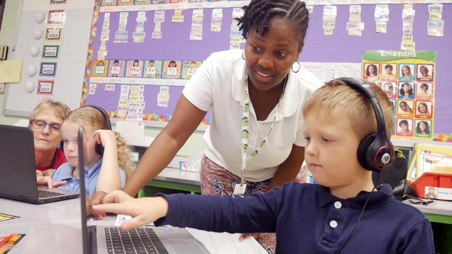 Teacher guiding student