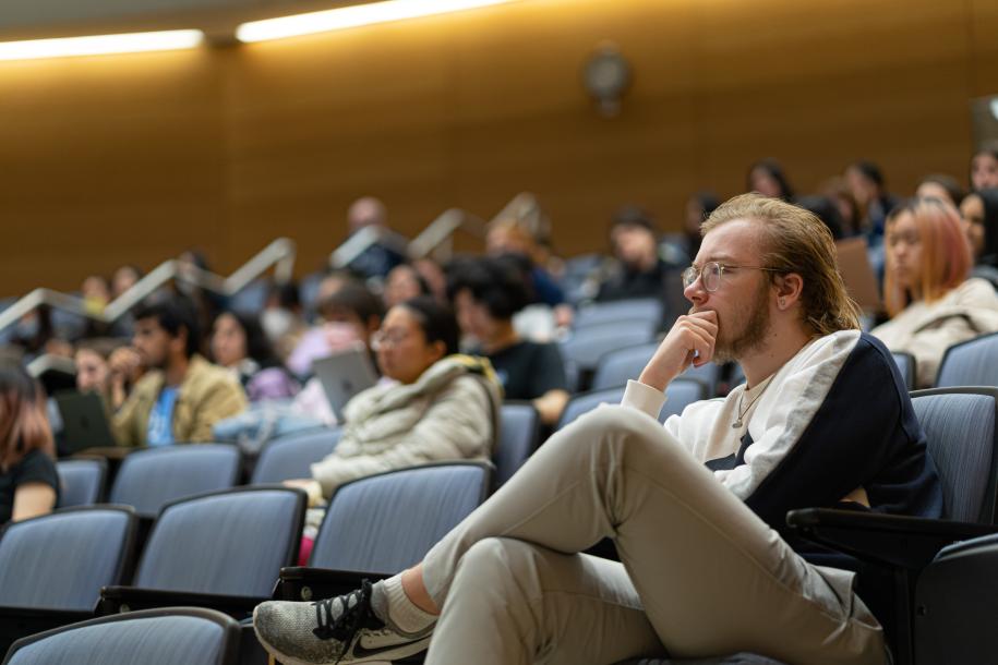students sitting in auditorium