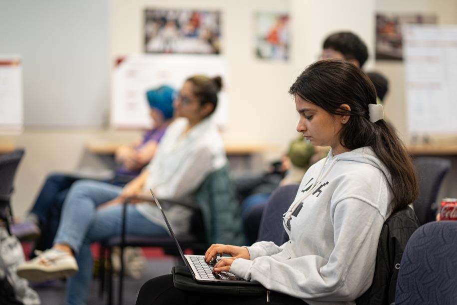 students sitting listening to lecture